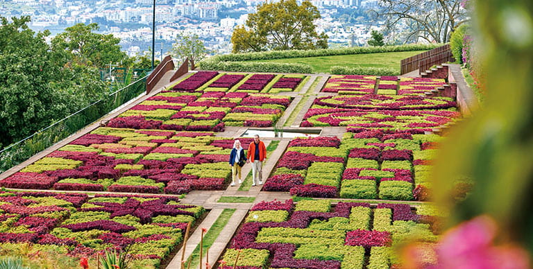 A couple walking through the icons Botanical Gardens of Madeira
